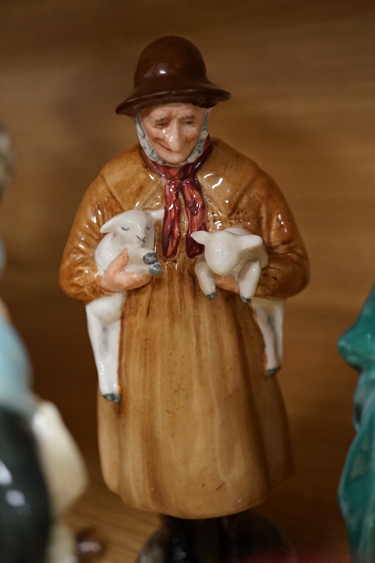 A collection of Royal Doulton figures to include The Old Balloon Seller, Doctor, Votes for Women and The Detective